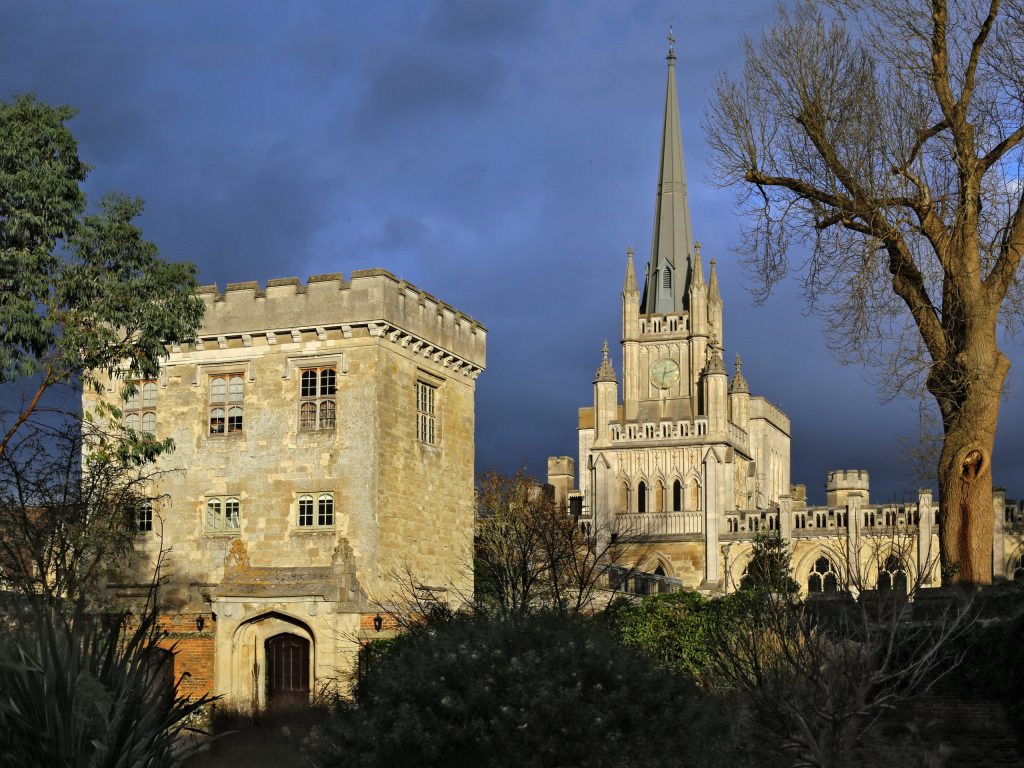 A picture of Ashridge college with a dark blue sky
